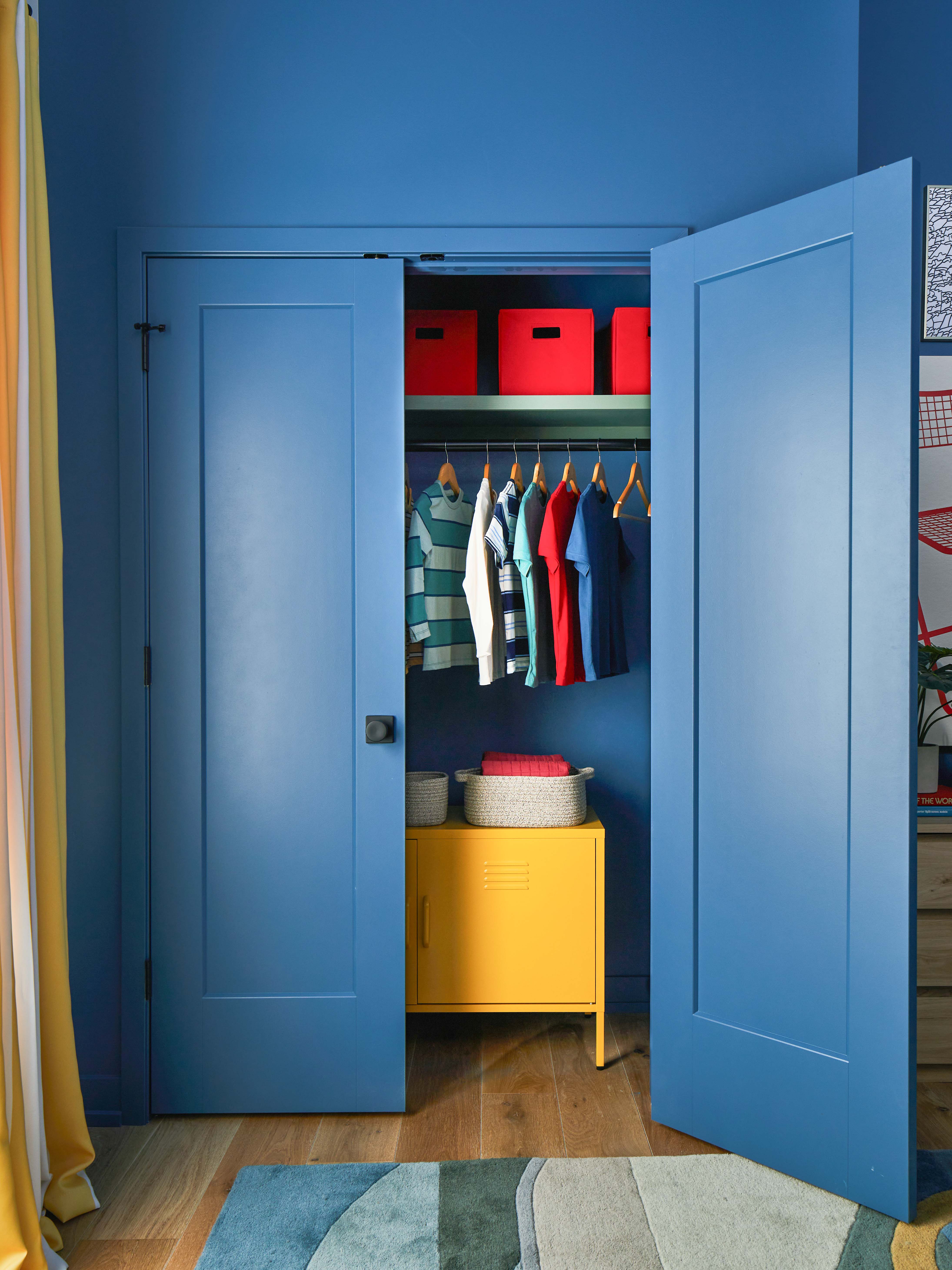 double blue doors leading into a closet in the 2024 HGTV Urban Oasis home